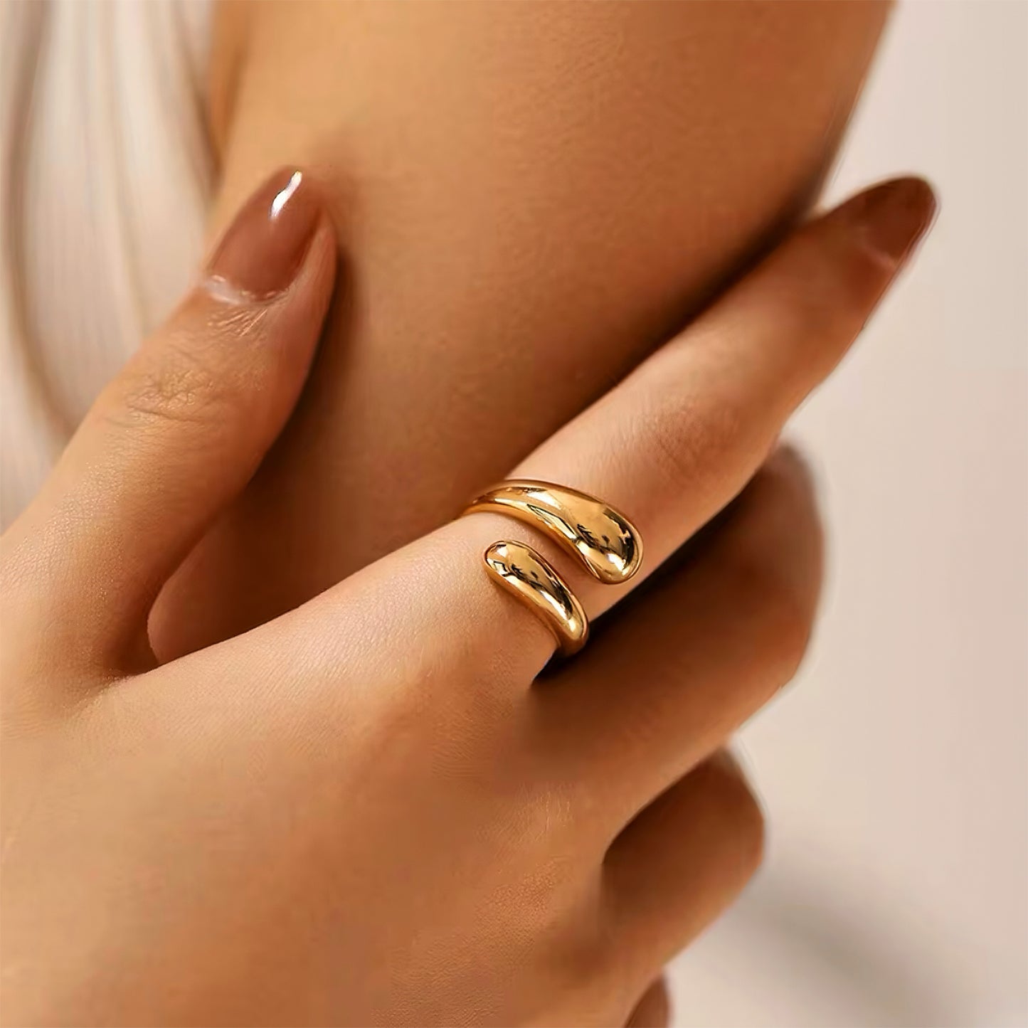 Muse Curve Ring in 18k gold plated finish with sculptural open design and rounded ends