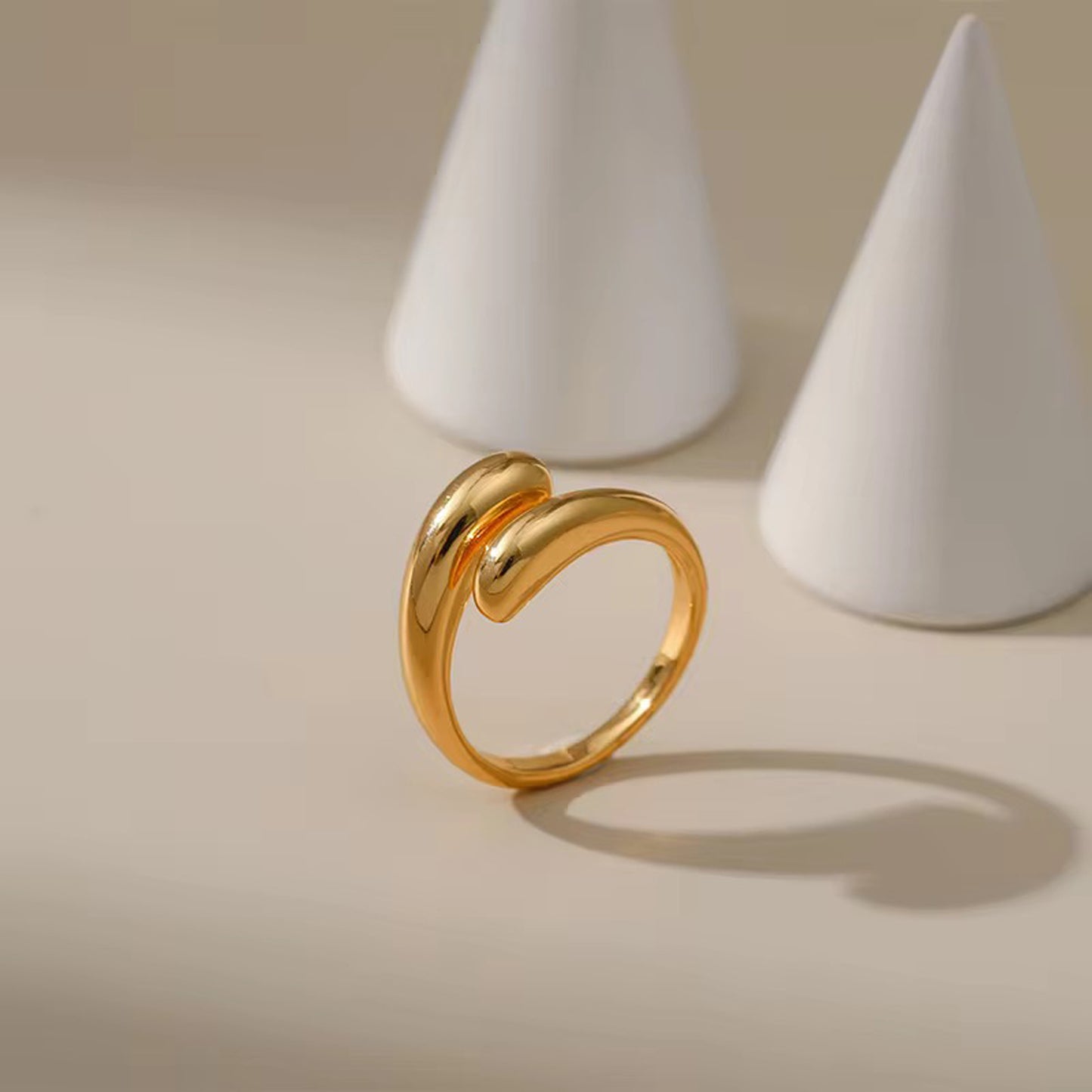 Muse Curve Ring in 18k gold plated finish with sculptural open design and rounded ends