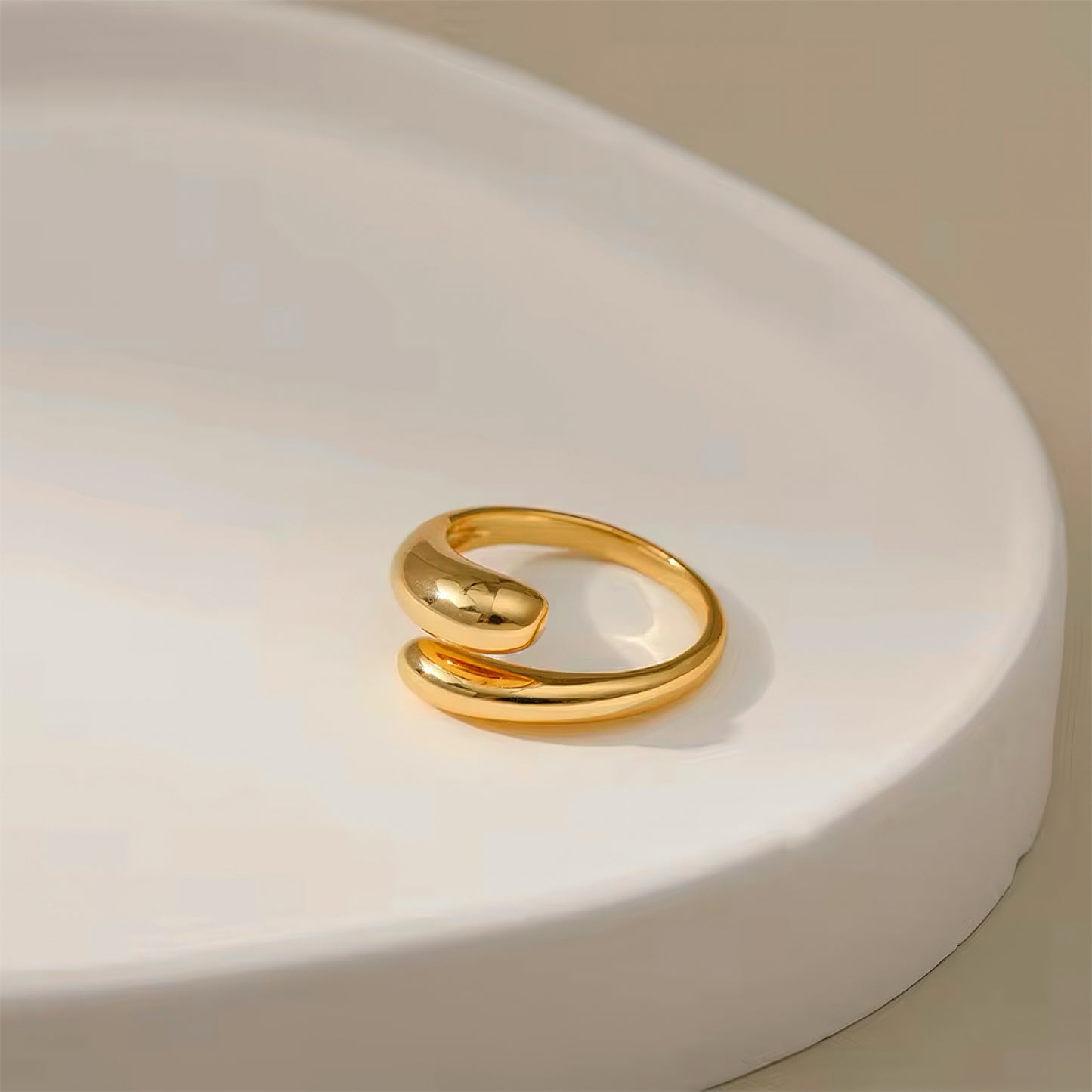 Muse Curve Ring in 18k gold plated finish with sculptural open design and rounded ends