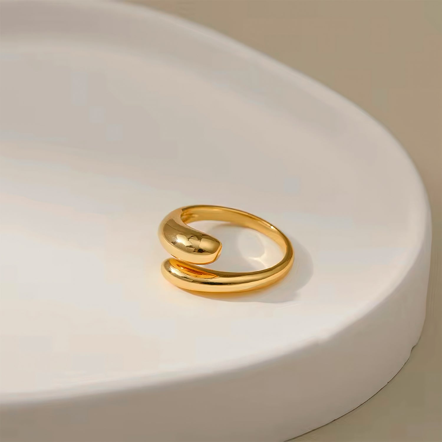 Muse Curve Ring in 18k gold plated finish with sculptural open design and rounded ends