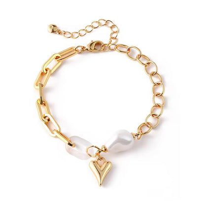 Freshwater pearl bracelet with gold-plated links and heart charm, elegant and romantic design 00021