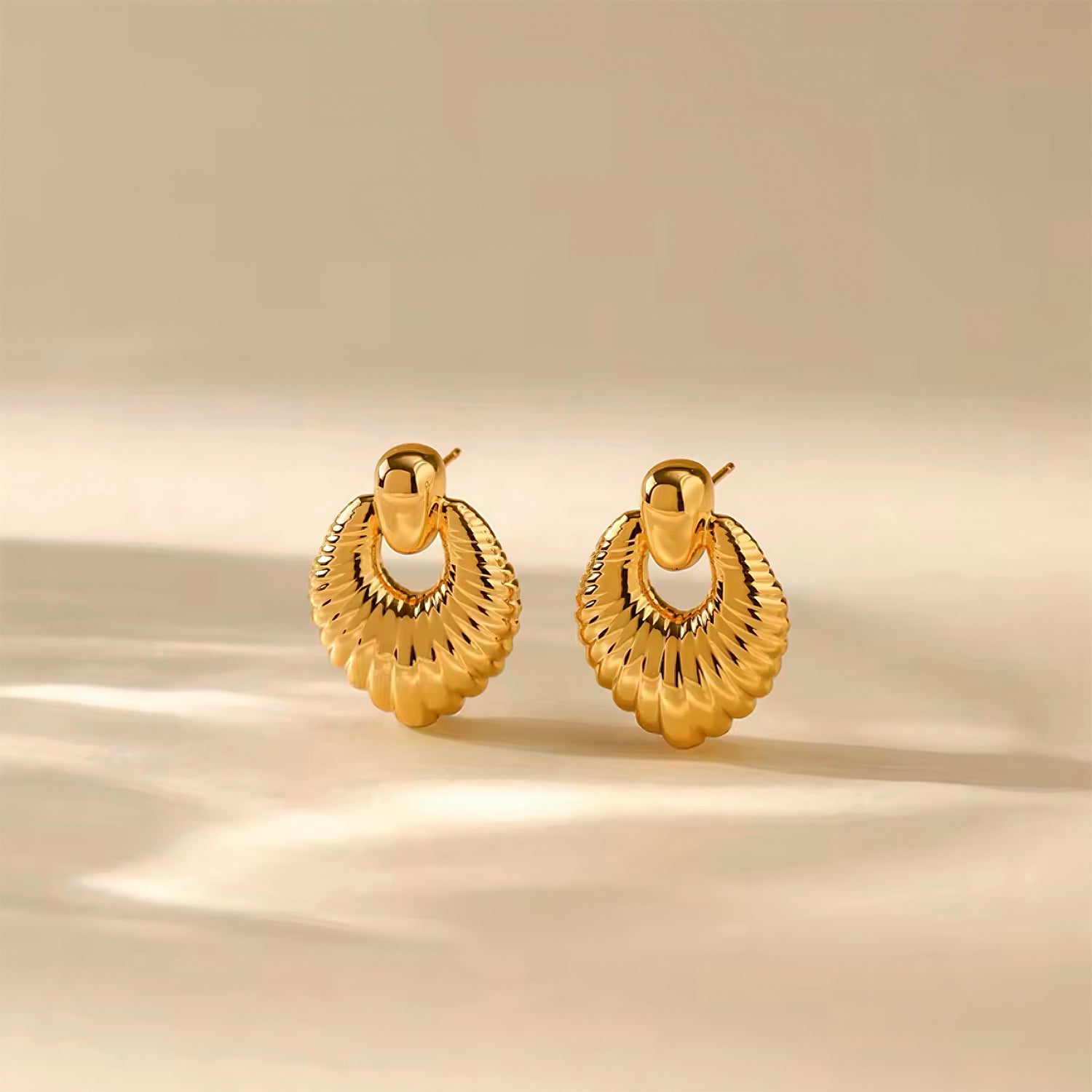 Golden Radiance Earrings with 18K gold plating and sculptural fan-shaped design with textured details 00011

