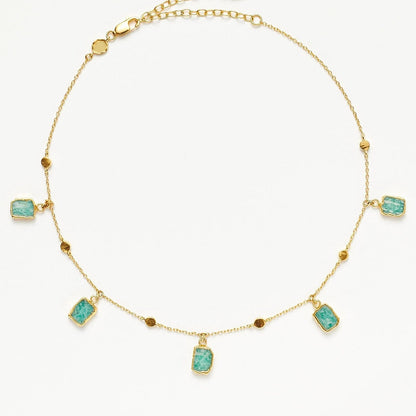 Isla Drops Necklace with turquoise-blue pendants and gold dotted chain, inspired by island light and coastal rhythm — designed by MiaPromise.
