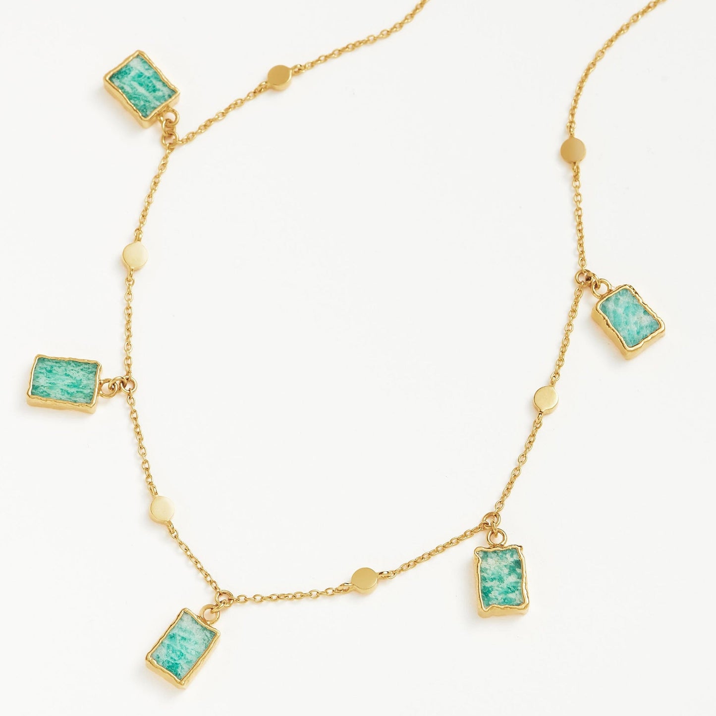 Isla Drops Necklace with turquoise-blue pendants and gold dotted chain, inspired by island light and coastal rhythm — designed by MiaPromise.