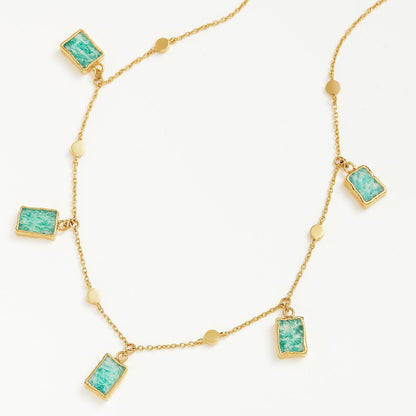 Isla Drops Necklace with turquoise-blue pendants and gold dotted chain, inspired by island light and coastal rhythm — designed by MiaPromise.