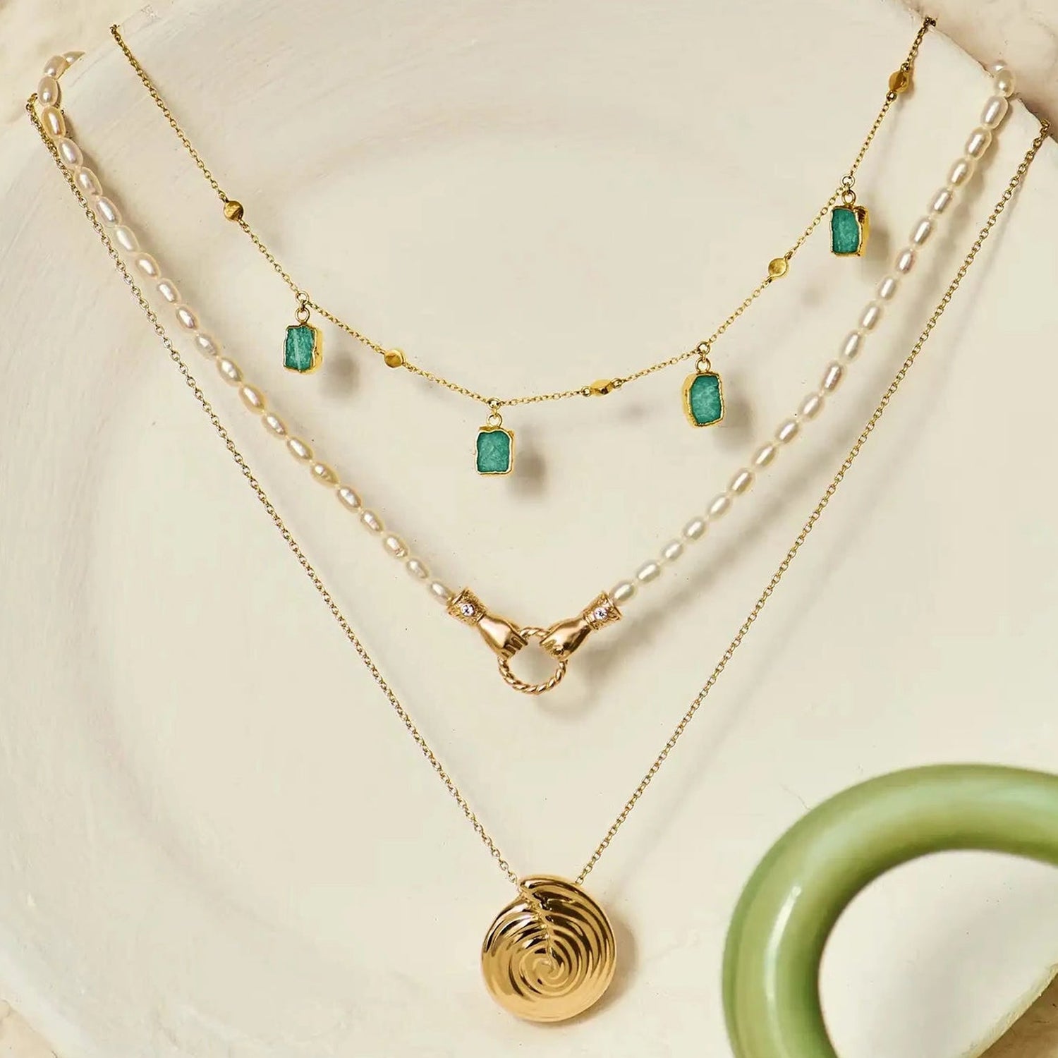 Isla Drops Necklace with turquoise-blue pendants and gold dotted chain, inspired by island light and coastal rhythm — designed by MiaPromise.