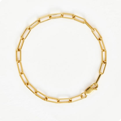 Minimalist gold chain bracelet with sculptural rectangular links, inspired by architectural lines and modern elegance — Linea by MiaPromise.