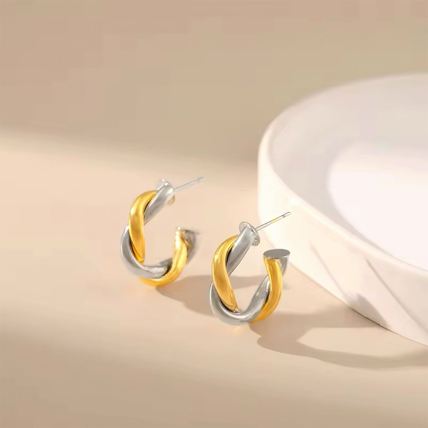 Gold and silver twisted hoop earrings inspired by the moon and sun, celestial design with timeless elegance 00040