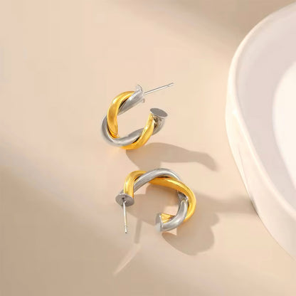 Gold and silver twisted hoop earrings inspired by the moon and sun, celestial design with timeless elegance  00041