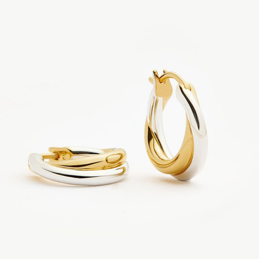 Two-tone gold and silver Luna Twist Hoops styled in ear, showcasing sculptural minimal design 00097
