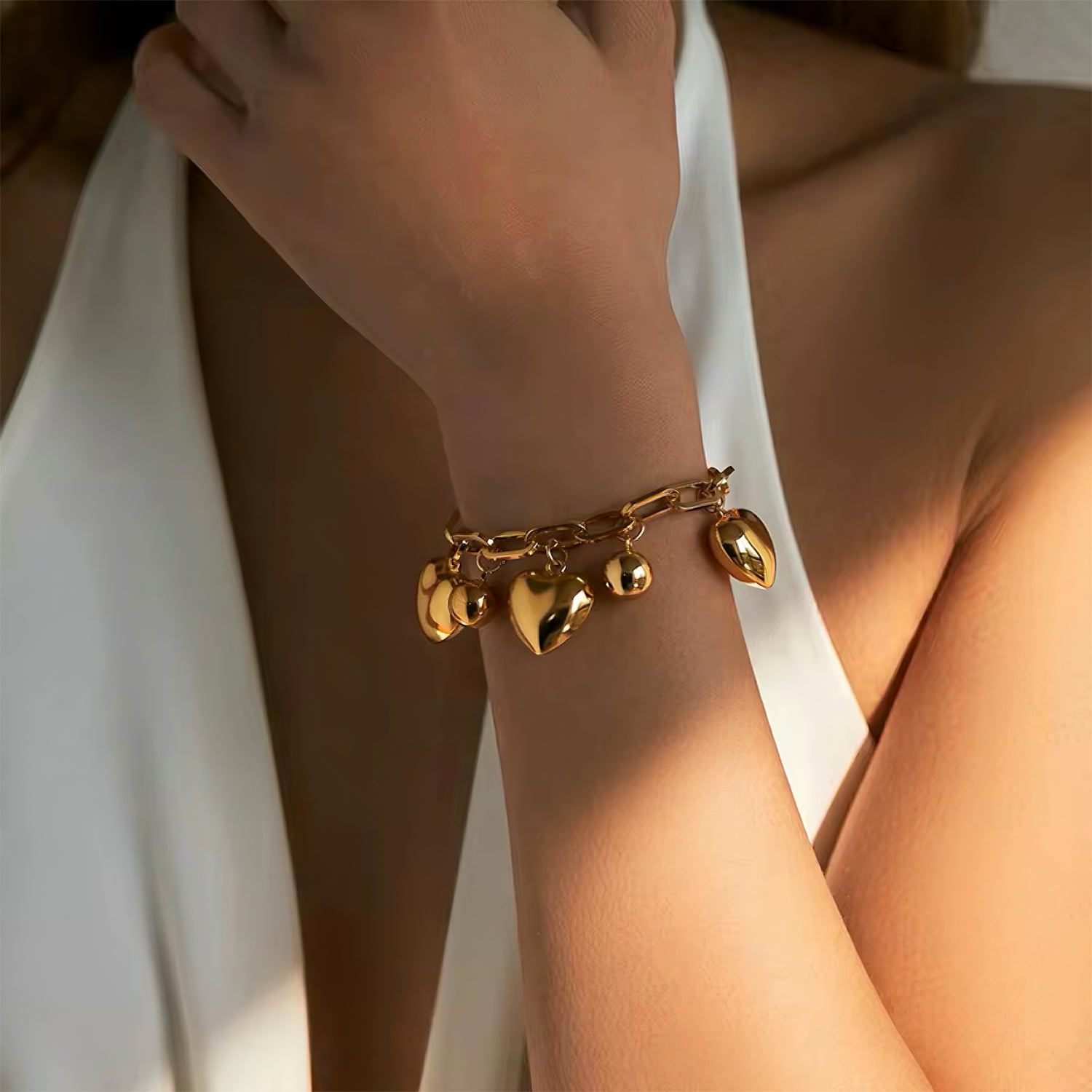 18K gold-plated bracelet with heart charm and polished ball pendant, adjustable for modern styling 00018