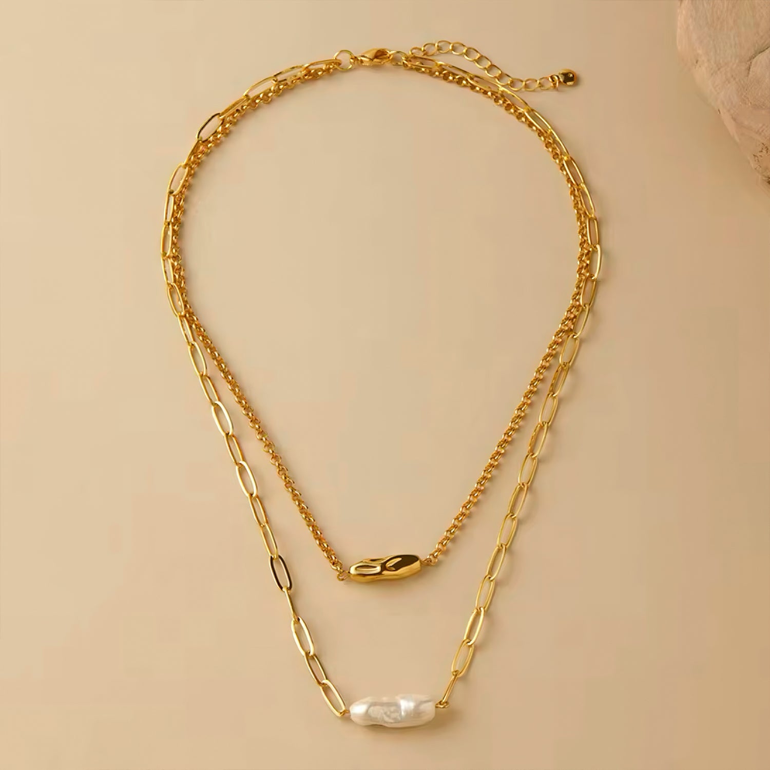 Layered gold necklace with freshwater pearl and dual chain design 00014
