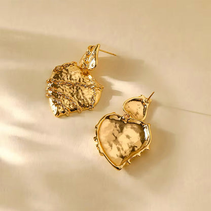 Molten heart-shaped gold statement earrings with sculptural texture and high-shine finish – Mia Promise Jewelry 00057