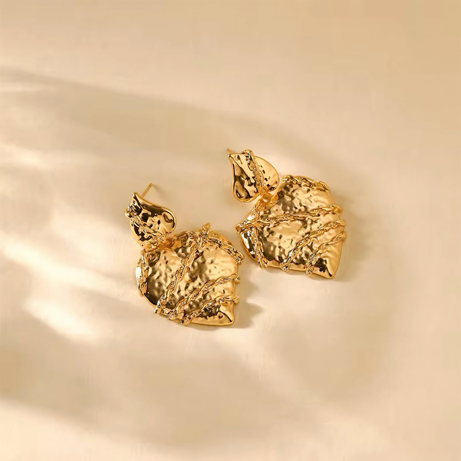 Molten heart-shaped gold statement earrings with sculptural texture and high-shine finish – Mia Promise Jewelry 00059