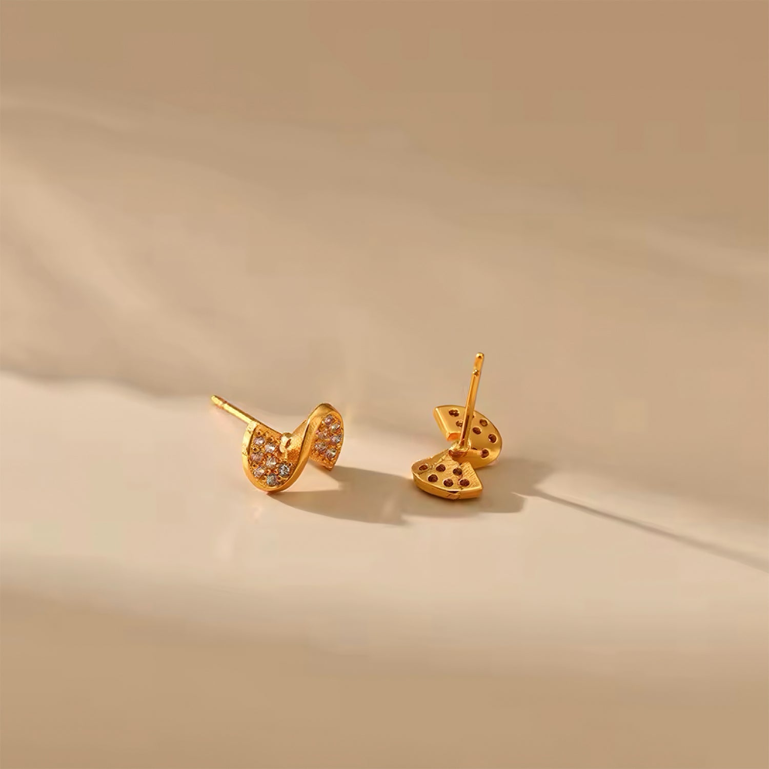 Ribbon Glow Stud Earrings with cubic zirconia – elegant gold ribbon design, perfect for everyday wear 00065