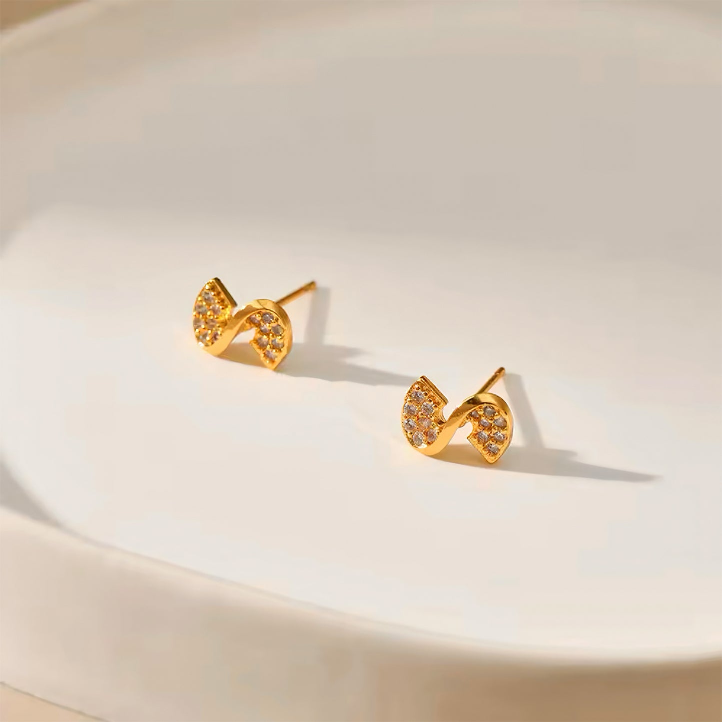 Ribbon Glow Stud Earrings with cubic zirconia – elegant gold ribbon design, perfect for everyday wear 00066