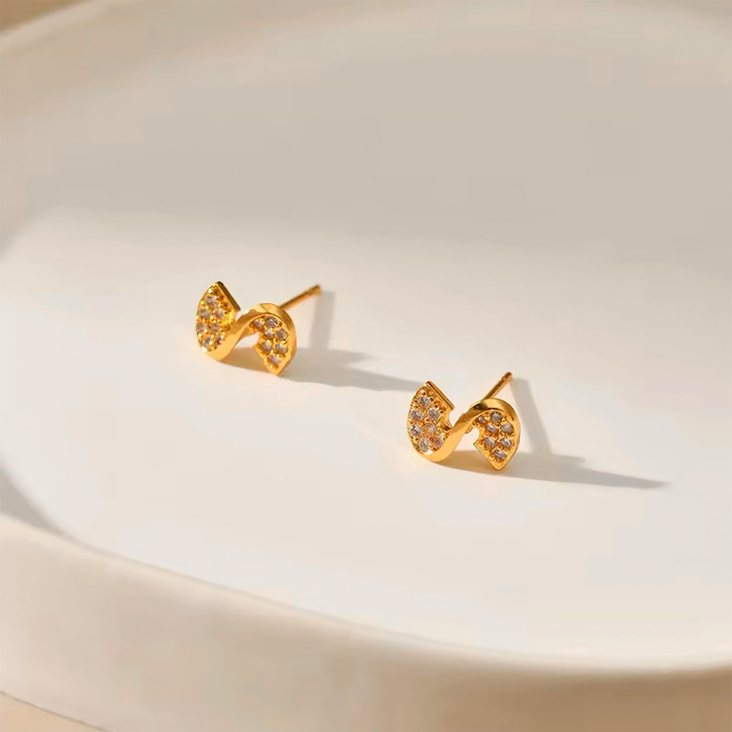 Ribbon Glow Stud Earrings with cubic zirconia – elegant gold ribbon design, perfect for everyday wear 00066