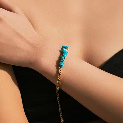 Bohemian-style bracelet with natural turquoise stones and gold hexagonal beads, adjustable for layering 00020