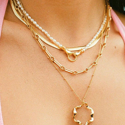 Unity Pearl Bracelet with clasped hands pendant and freshwater pearls, symbolizing trust and connection — designed by MiaPromise