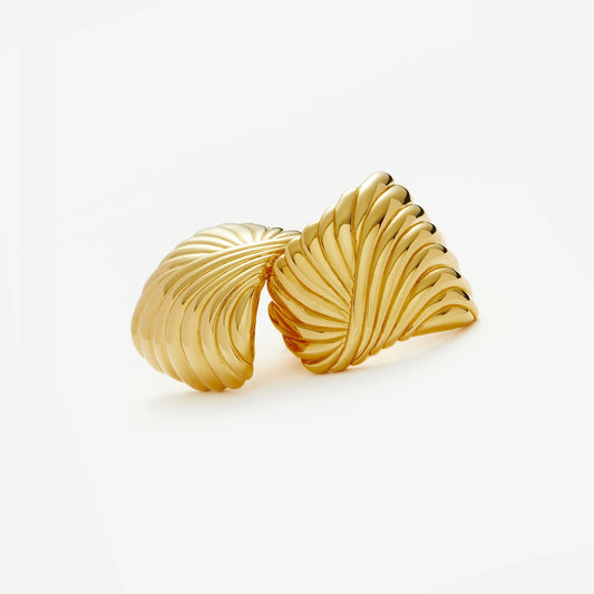 Sculptural gold feather earrings inspired by wind and movement, bold yet elegant with curved design — Zephyr by MiaPromise